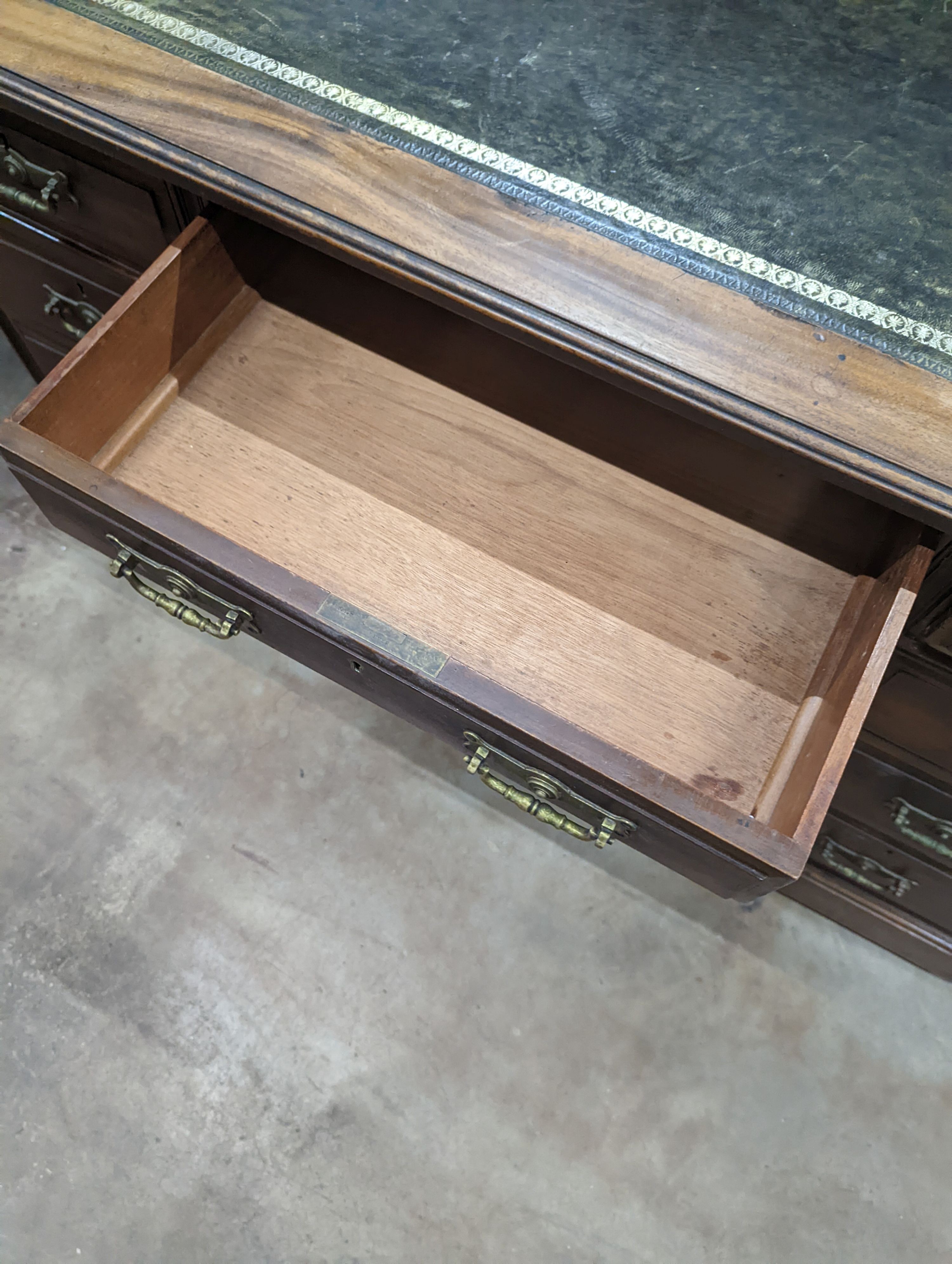 A late Victorian walnut pedestal desk, length 122cm, depth 68cm, height 76cm